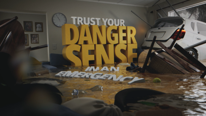 In a flooded living room, large blocky words read 'Trust your danger sense in an emergency'.