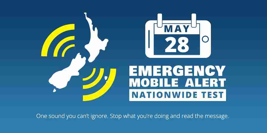 A map of New Zealand with rounded lines pulsing from it. Next to is a calendar in the shape of a phone with May 28. Below the text reads Emergency Mobile Alert nationwide test. One sound you can&#039;t ignore. Stop what you&#039;re doing and read the message.
