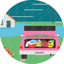 A car with a boot full of emergency supplies and the license plate &#039;Get4way&#039;. It is raining and flooding around a house in the background